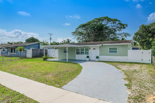 180 NW 18th St, Pompano Beach, FL 33060 - single story home with fence, stucco siding, a front lawn, a gate, and driveway