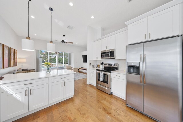 12761 Yardley Dr, Boca Raton, FL 33428 - kitchen featuring light wood-style floors, a ceiling fan, appliances with stainless steel finishes, light countertops, and open floor plan