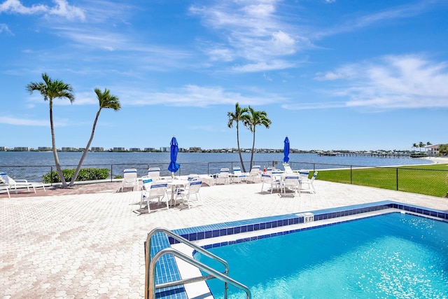 1502 S Lakeside Dr Unit 318, Lake Worth, FL 33460 - community pool with fence, a water view, and a patio area