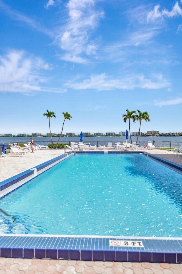 1502 S Lakeside Dr Unit 318, Lake Worth, FL 33460 - community pool with a patio area