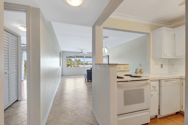 1502 S Lakeside Dr Unit 318, Lake Worth, FL 33460 - kitchen featuring white appliances, a ceiling fan, light countertops, white cabinetry, and light tile patterned flooring