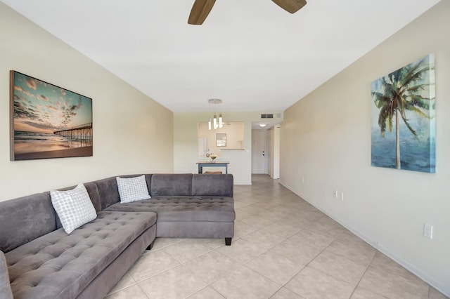 1502 S Lakeside Dr Unit 318, Lake Worth, FL 33460 - living area featuring a ceiling fan, light tile patterned floors, and baseboards