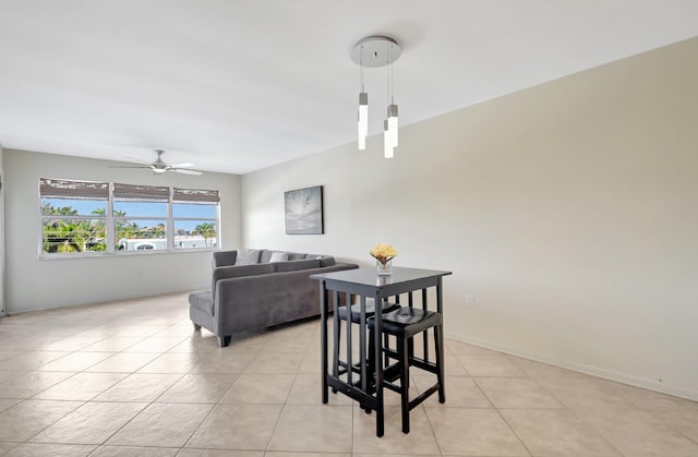 1502 S Lakeside Dr Unit 318, Lake Worth, FL 33460 - dining space with a ceiling fan, light tile patterned flooring, and baseboards