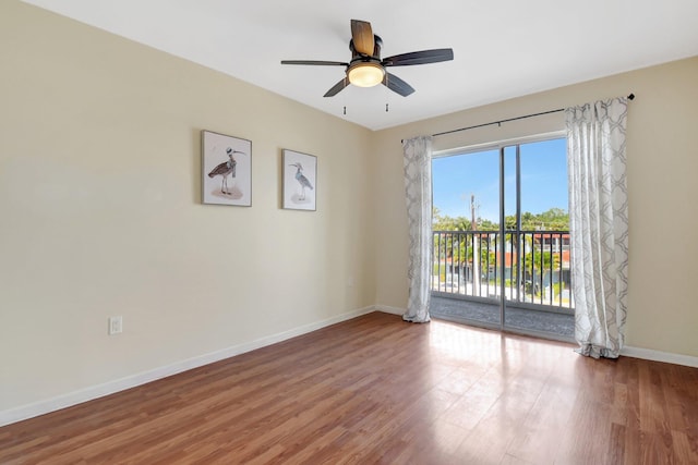 1502 S Lakeside Dr Unit 318, Lake Worth, FL 33460 - spare room featuring baseboards, wood finished floors, and a ceiling fan
