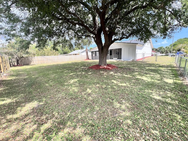 view of yard with a fenced backyard