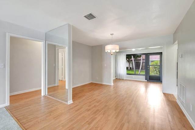 9805 Walnut Tree A Way Unit A, Boynton Beach, FL 33436 - unfurnished dining area with a chandelier, visible vents, and light wood-type flooring