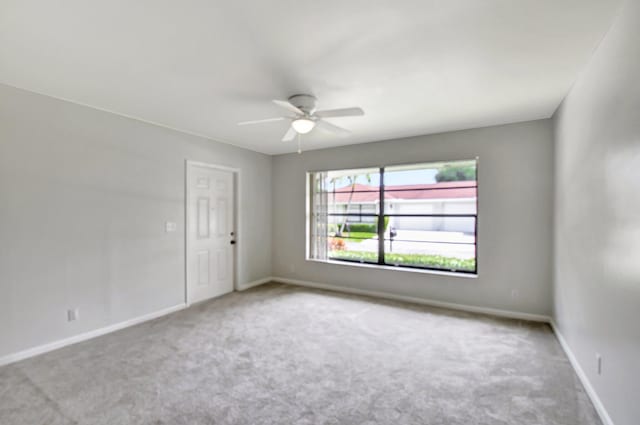 9805 Walnut Tree A Way Unit A, Boynton Beach, FL 33436 - spare room featuring baseboards, a ceiling fan, and carpet flooring