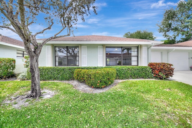 9805 Walnut Tree A Way Unit A, Boynton Beach, FL 33436 - ranch-style home featuring a front yard and stucco siding