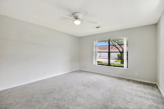 9805 Walnut Tree A Way Unit A, Boynton Beach, FL 33436 - carpeted spare room featuring a textured ceiling, visible vents, a ceiling fan, and baseboards