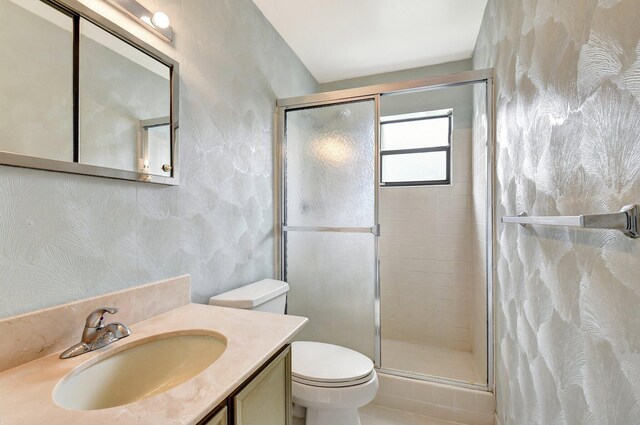 9805 Walnut Tree A Way Unit A, Boynton Beach, FL 33436 - bathroom with vanity, a shower stall, and toilet