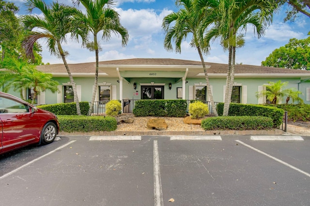 9805 Walnut Tree A Way Unit A, Boynton Beach, FL 33436 - view of building exterior with uncovered parking