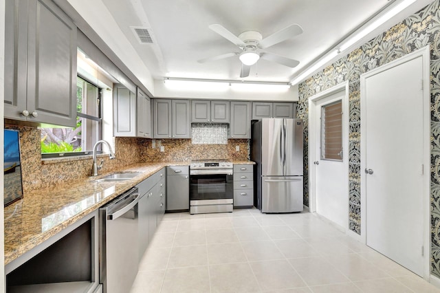 9805 Walnut Tree A Way Unit A, Boynton Beach, FL 33436 - kitchen with visible vents, a sink, light tile patterned flooring, gray cabinetry, and appliances with stainless steel finishes