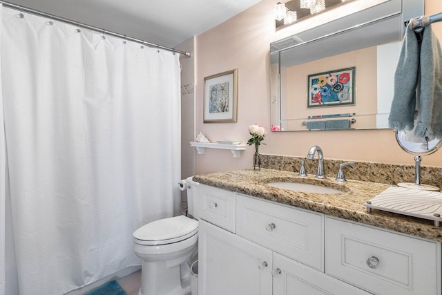 full bath with toilet and vanity