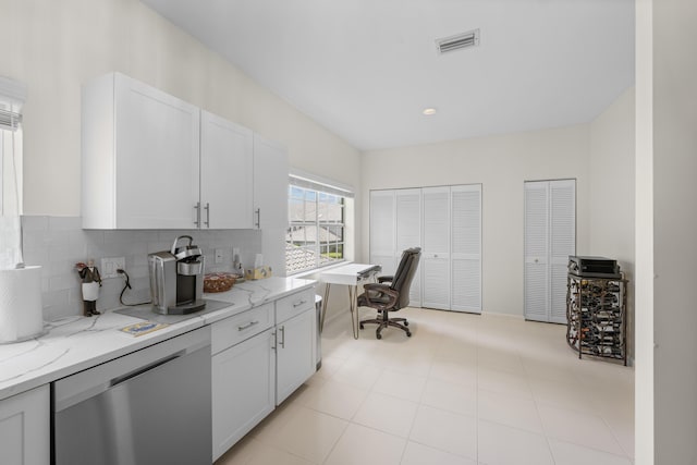kitchen featuring visible vents, light stone countertops, white cabinetry, and dishwasher