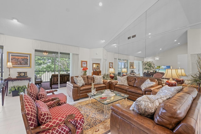 living area featuring light tile patterned floors, high vaulted ceiling, recessed lighting, and visible vents