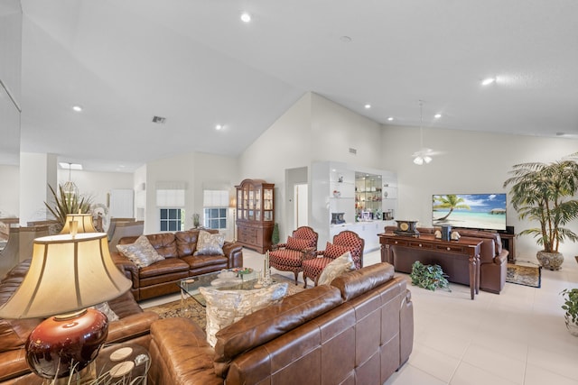 living area featuring a ceiling fan, visible vents, light tile patterned floors, high vaulted ceiling, and recessed lighting