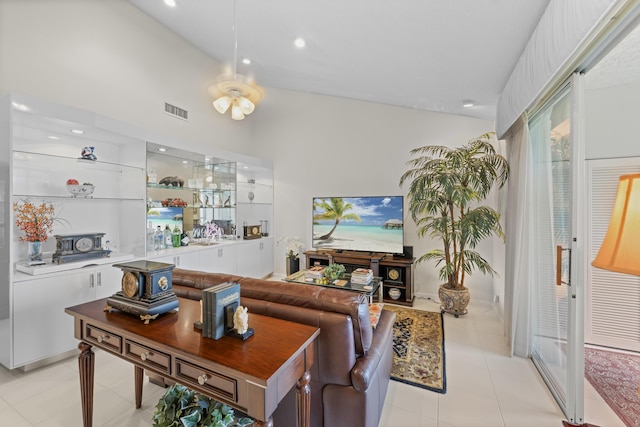living room featuring visible vents, recessed lighting, light tile patterned flooring, and vaulted ceiling