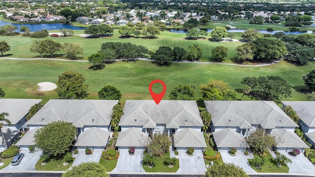 birds eye view of property with a residential view, a water view, and golf course view