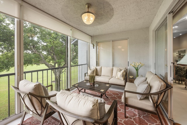 sunroom with an outdoor living space