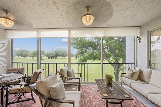 sunroom / solarium featuring golf course view