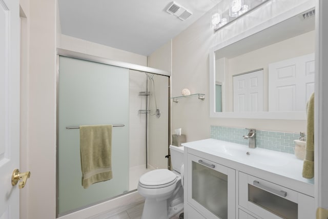 full bathroom with visible vents, decorative backsplash, vanity, toilet, and a shower stall
