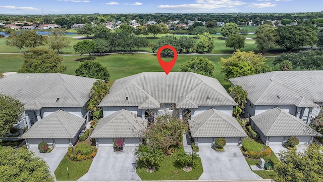 bird's eye view featuring view of golf course and a residential view