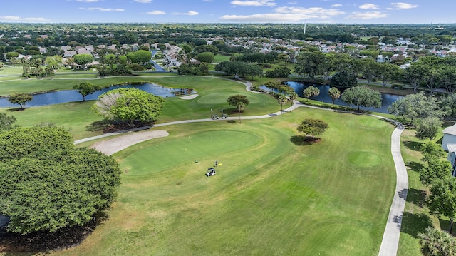 birds eye view of property with a water view, view of golf course, and a residential view