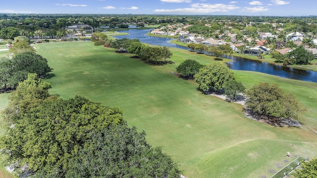 birds eye view of property featuring a water view, golf course view, and a residential view