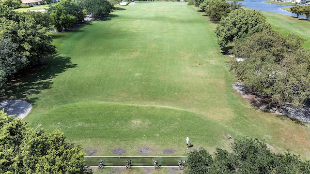 birds eye view of property featuring a water view and view of golf course