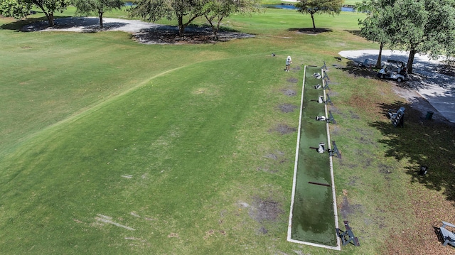 aerial view with a water view and golf course view