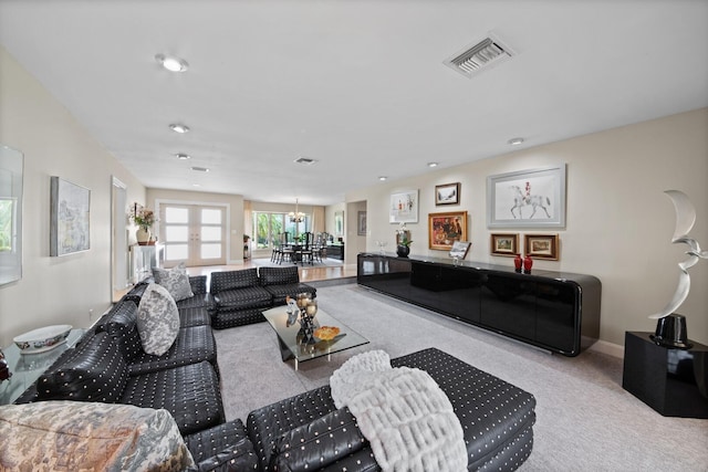 7 Inlet Cay Dr, Ocean Ridge, FL 33435 - carpeted living area featuring recessed lighting, visible vents, and a notable chandelier