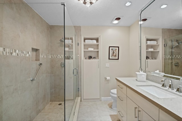 7 Inlet Cay Dr, Ocean Ridge, FL 33435 - full bathroom featuring a stall shower, baseboards, toilet, tile patterned floors, and vanity