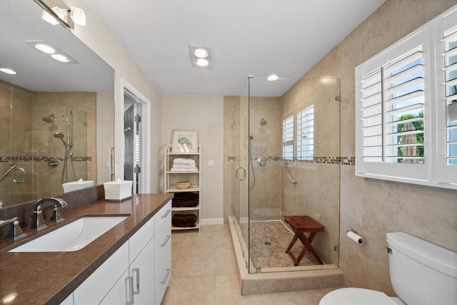7 Inlet Cay Dr, Ocean Ridge, FL 33435 - bathroom with vanity, toilet, tile patterned flooring, and a stall shower