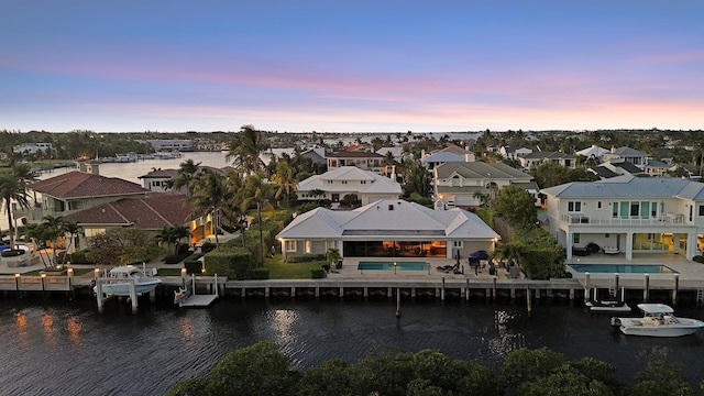 7 Inlet Cay Dr, Ocean Ridge, FL 33435 - aerial view at dusk featuring a water view and a residential view