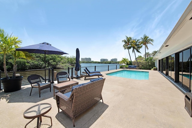 7 Inlet Cay Dr, Ocean Ridge, FL 33435 - view of swimming pool with a water view, a patio, and a fenced in pool