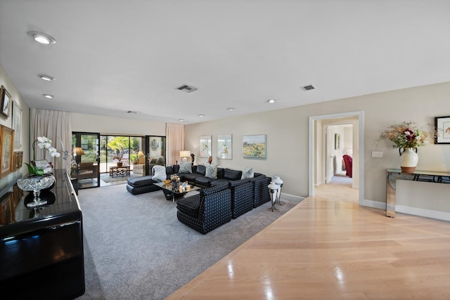 7 Inlet Cay Dr, Ocean Ridge, FL 33435 - carpeted living room with wood finished floors, visible vents, baseboards, and recessed lighting