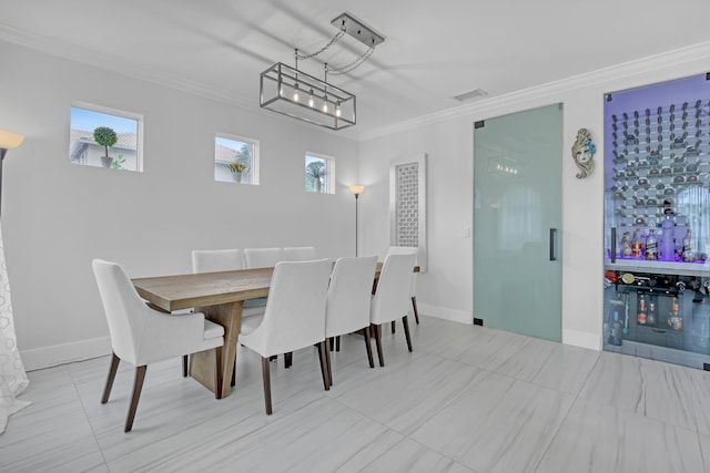 8086 Bautista Way, Palm Beach Gardens, FL 33418 - dining area with baseboards, ornamental molding, and a wealth of natural light