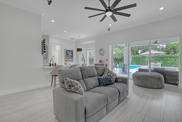 8086 Bautista Way, Palm Beach Gardens, FL 33418 - living area with a ceiling fan, light tile patterned floors, baseboards, ornamental molding, and recessed lighting