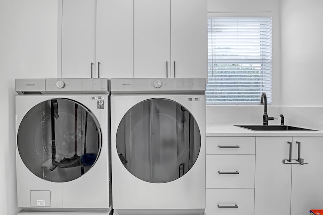 8086 Bautista Way, Palm Beach Gardens, FL 33418 - laundry room featuring washer and clothes dryer, a sink, and cabinet space