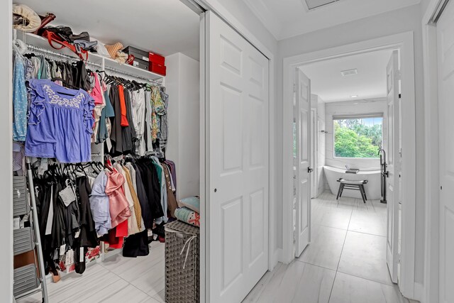 8086 Bautista Way, Palm Beach Gardens, FL 33418 - spacious closet featuring tile patterned flooring