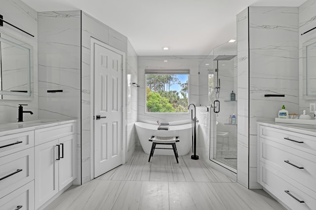 8086 Bautista Way, Palm Beach Gardens, FL 33418 - full bath featuring vanity, tile walls, a stall shower, and a freestanding bath
