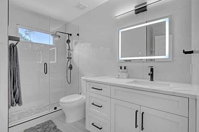 8086 Bautista Way, Palm Beach Gardens, FL 33418 - bathroom featuring visible vents, vanity, marble finish floor, toilet, and a stall shower