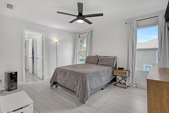 8086 Bautista Way, Palm Beach Gardens, FL 33418 - bedroom with baseboards, ceiling fan, and visible vents