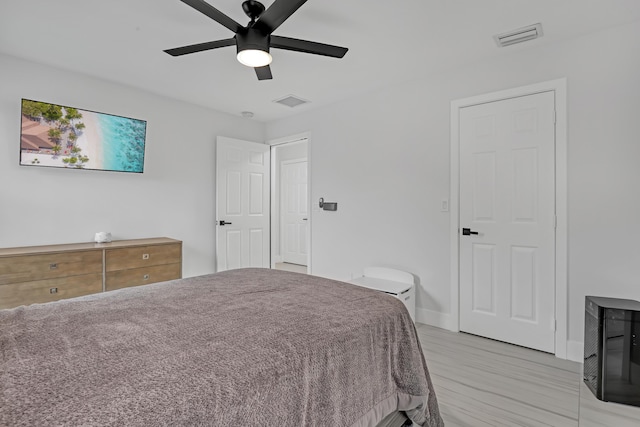 8086 Bautista Way, Palm Beach Gardens, FL 33418 - bedroom featuring visible vents, a ceiling fan, baseboards, and light wood-style floors
