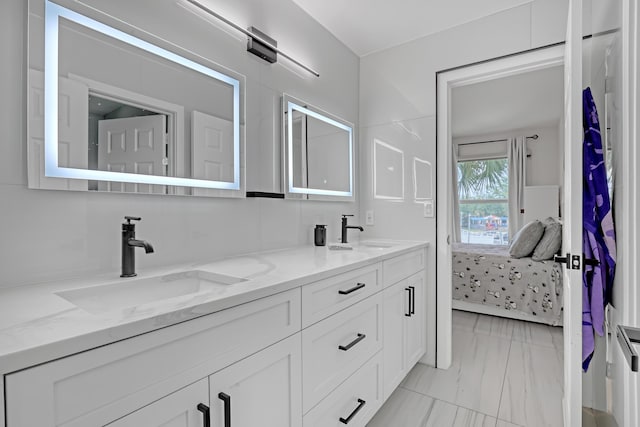 8086 Bautista Way, Palm Beach Gardens, FL 33418 - ensuite bathroom with double vanity, marble finish floor, a sink, and ensuite bathroom