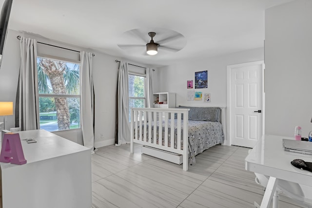 8086 Bautista Way, Palm Beach Gardens, FL 33418 - bedroom featuring baseboards, ceiling fan, and baseboard heating