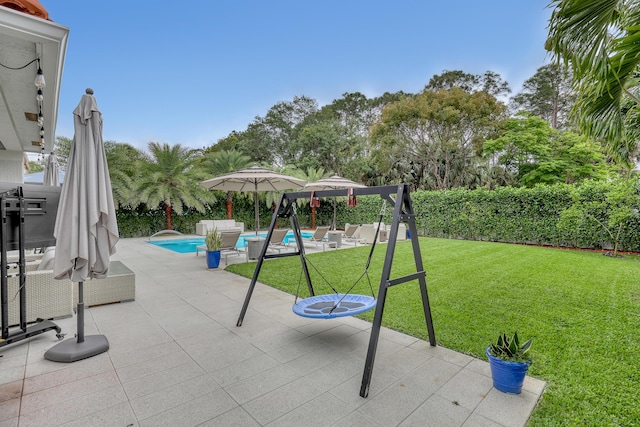 8086 Bautista Way, Palm Beach Gardens, FL 33418 - view of play area with a yard, a patio, a fenced in pool, and a fenced backyard