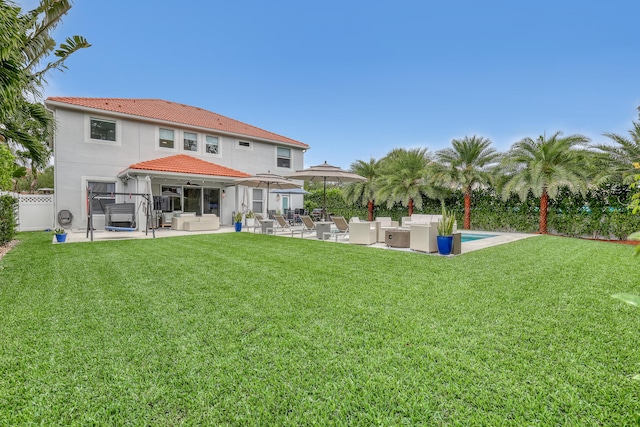 8086 Bautista Way, Palm Beach Gardens, FL 33418 - back of house featuring a tile roof, a patio area, fence, a yard, and outdoor lounge area