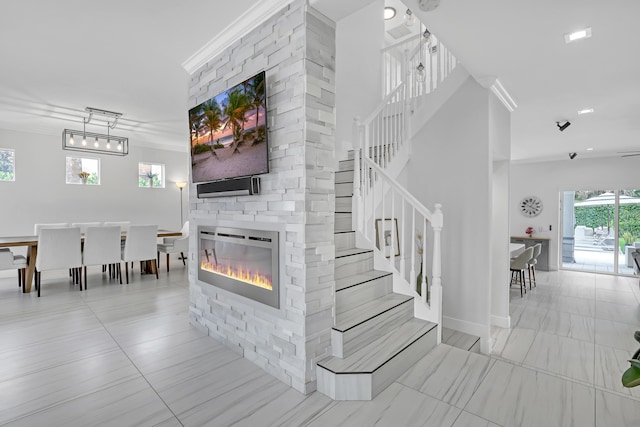 8086 Bautista Way, Palm Beach Gardens, FL 33418 - stairs featuring ornamental molding and a fireplace