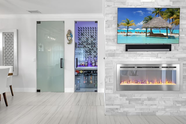 8086 Bautista Way, Palm Beach Gardens, FL 33418 - unfurnished living room featuring crown molding, tile patterned floors, a large fireplace, baseboards, and visible vents